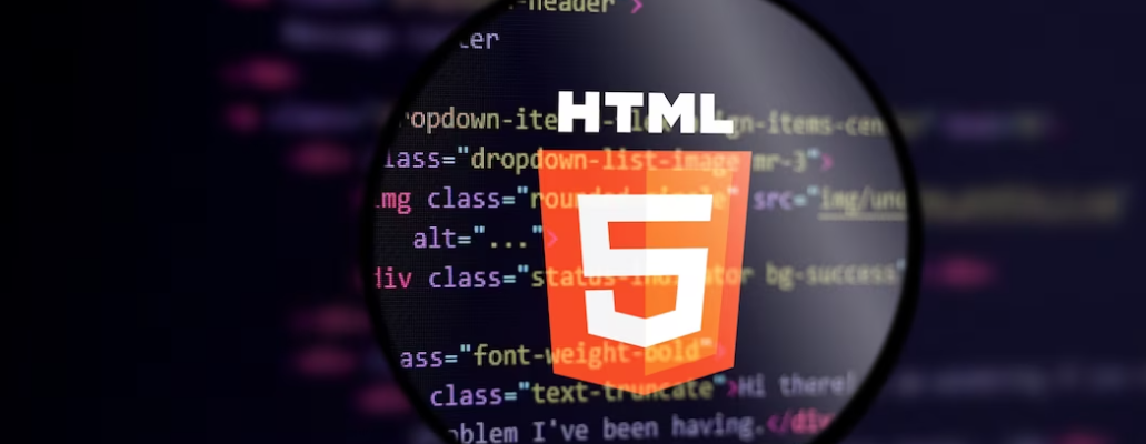 html 5 and coding on the black screen under the magnifying glass