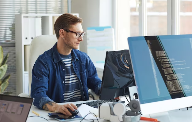 A man works at a computer